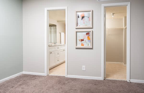 a bathroom with a mirror and two pictures on the wall at Fairways of Inverrary, Lauderhill, FL, 33319