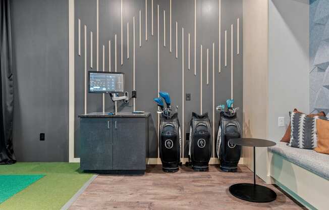 golf clubs in our golf simulator room at The Lodge in Rochester Minnesota