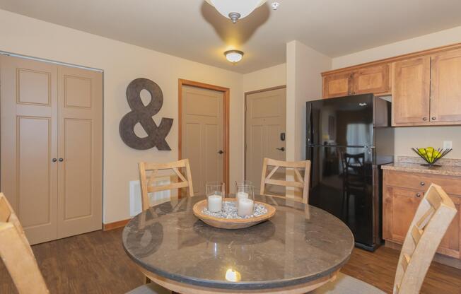 a kitchen with wooden cabinets in a room