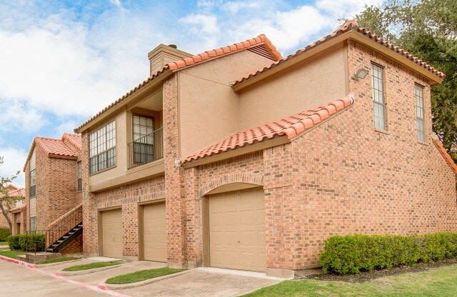 a brick house with a garage door