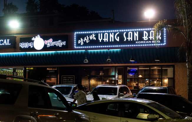 the front of the restaurant at night