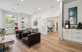 a living room with two leather couches and a coffee table