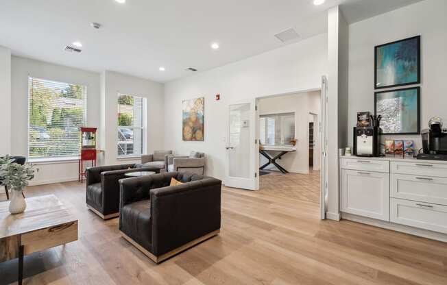 a living room with two leather couches and a coffee table