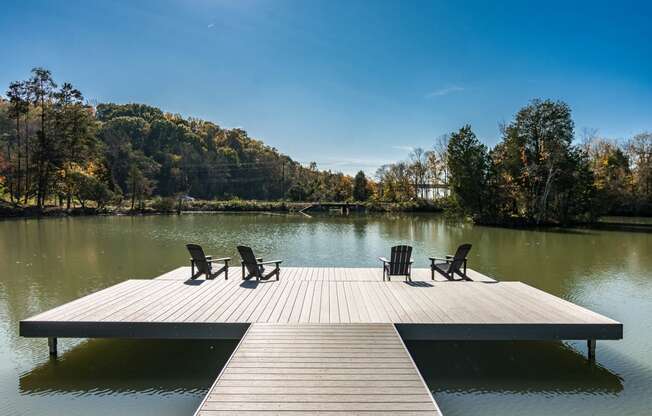 a dock at a lake with chairs on it at Village at Westland Cove Apartments, Knoxville