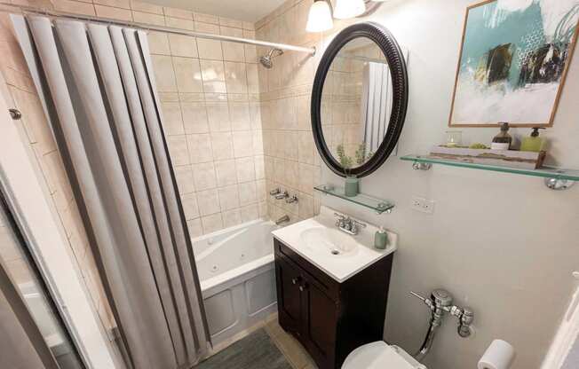 a small bathroom with a shower and a sink and a toilet