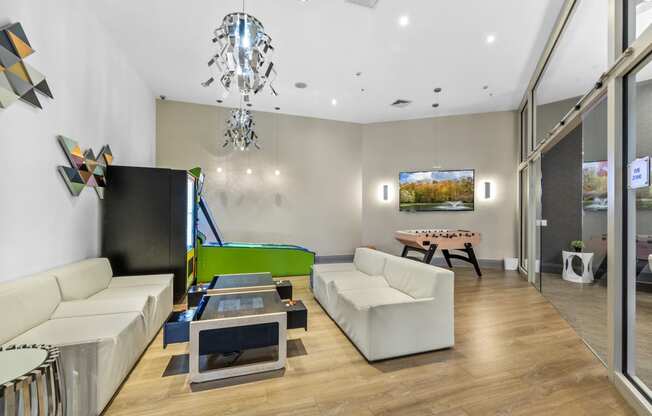 a games room with a foosball table and ping pong table at Harbor Pointe, Bayonne