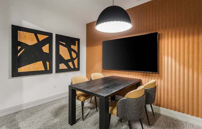 A modern dining room with a wooden table and chairs.
