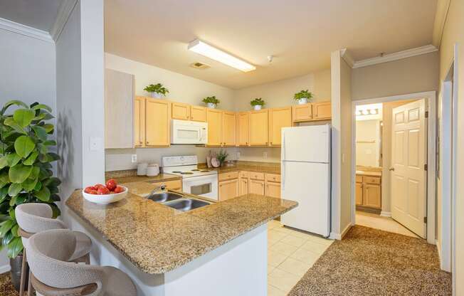 a kitchen with a granite counter top and a sink