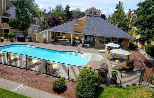 Nickel Creek Apartments in Lynwood, Washington Pool with Lounge Chairs and Covered Seating