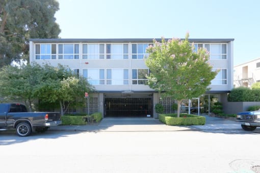 Front of 36th Ave Apartments a building with large windows facing the street side