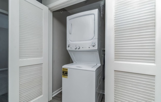 the laundry room has a washer and dryer in it