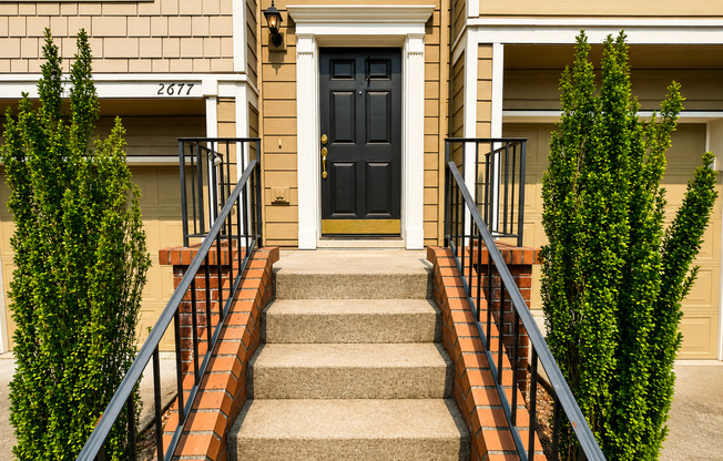 Spacious 3-Bedroom Forest Heights Townhome with Dual Primary Suites, Ground-Level Bedroom, Private Backyard & Wooded Views