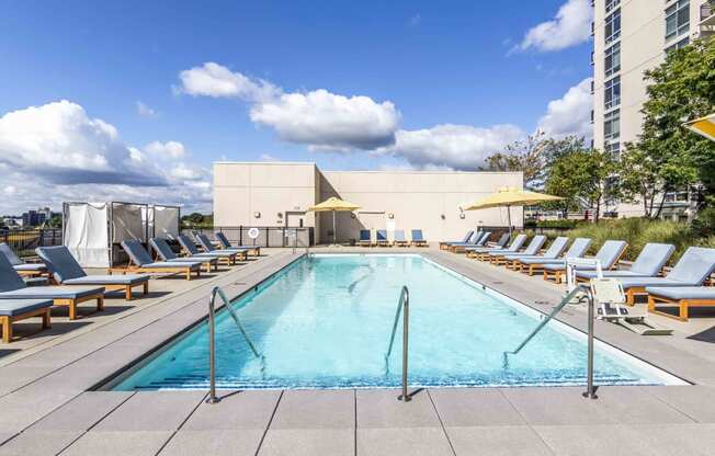 Rooftop pool with lounge chairs