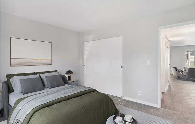 Model Bedroom with Carpet and Closet at Overlook Point Apartments in Salt Lake City, UT.