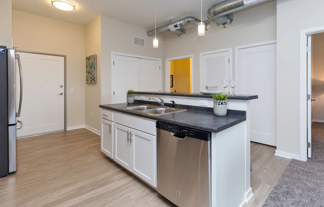 Stainless Steel appliances and white cabinetry in itchen | Apartments Des Moines, Iowa | Cityville I