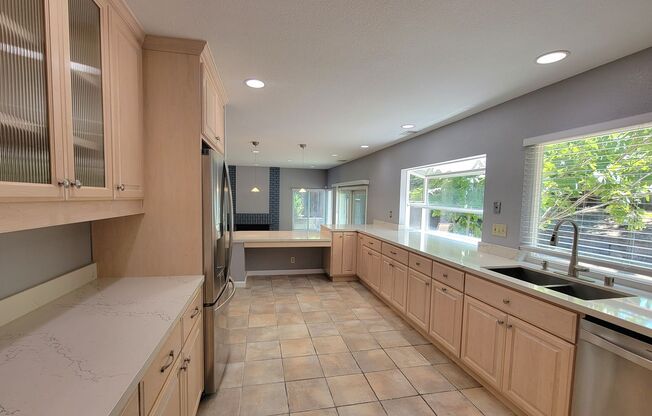 Spacious Beauty with Remodeled Kitchen and your Own Backyard Oasis!
