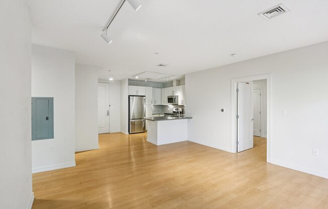 Unfurnished living room with kitchen view at Park77 Apartments, Cambridge, 02138
