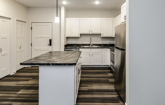 New building with white and dark color schemes with one, two and three bedroom apartment homes at CopperCreek Apartments in Council Bluffs, IA