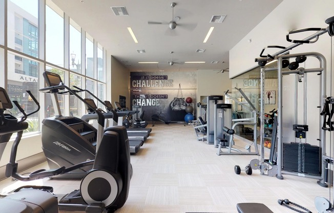 Floor to ceiling windows flood this fitness center with natural light