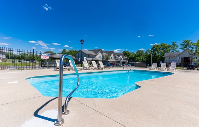 the swimming pool at the estates apartments