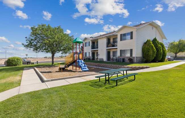 our apartments are equipped with a playground and picnic table