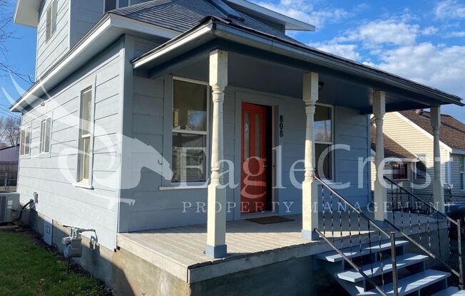 Charming 2 Bedroom Home With 1 Car Garage and A Covered Porch