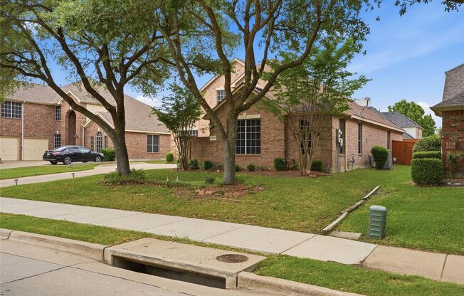Tucked inside Rowlett's sought-after Waterview community