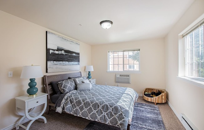 a bedroom with a bed and two windows  at Quail Springs, Washington