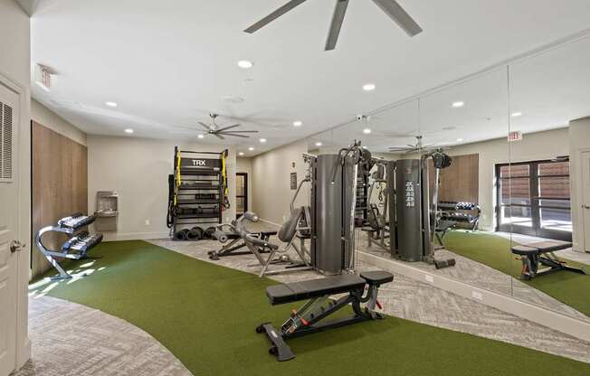 Flatiron West Trade Apartments 24 hour fitness center with free weights, cardio machines, and weightlifting machines