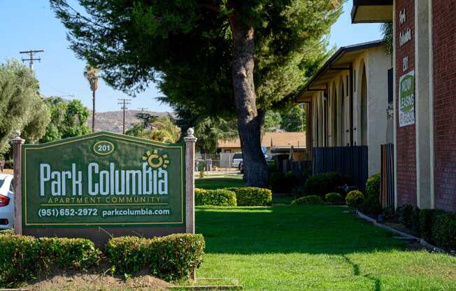 a sign in front of a building at Park Columbia Apts, California, 92544