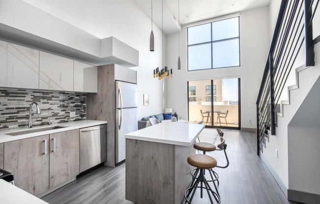Luxury Kitchen with Balcony Access at The Mansfield at Miracle Mile, California