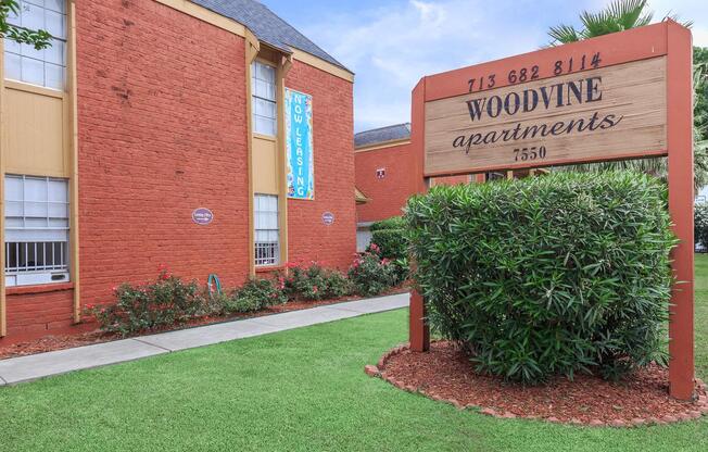 a sign in front of a brick building