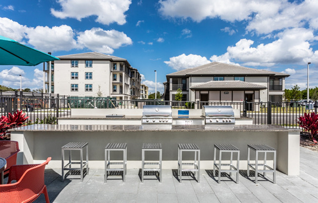 grilling station with apartment building in background in daytime