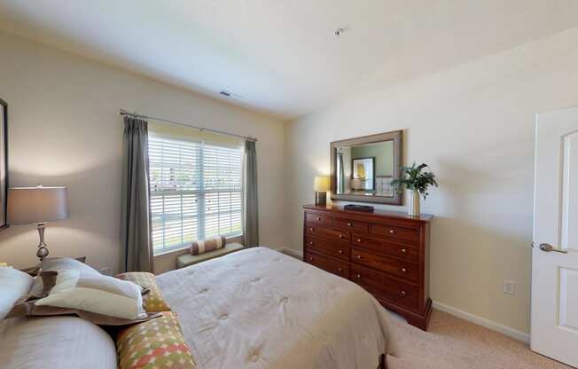 Bedroom with window; carpet