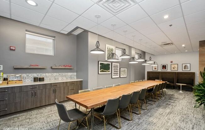 a conference room with a long table and chairs