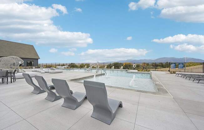 the pool area at the club at highland apartments