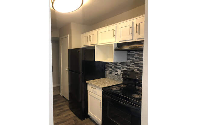 a stainless steel refrigerator in a kitchen