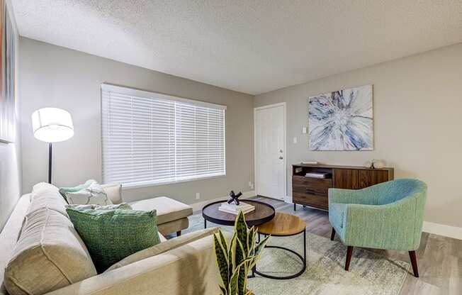 Furnished living room with large window at The Edge on the Boulevard, Fremont, CA
