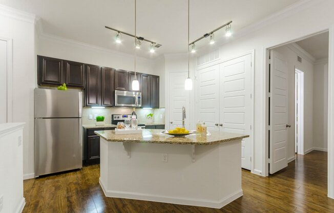 Kitchen area view with lights at Villages 3Eighty, Little Elm, 75068