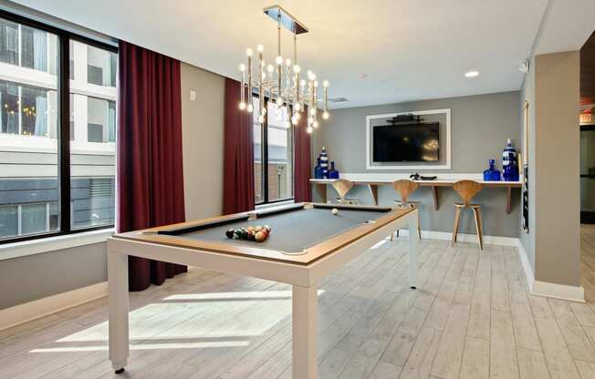 Clubhouse game room with billiards at The Dartmouth North Hills Apartments, Raleigh