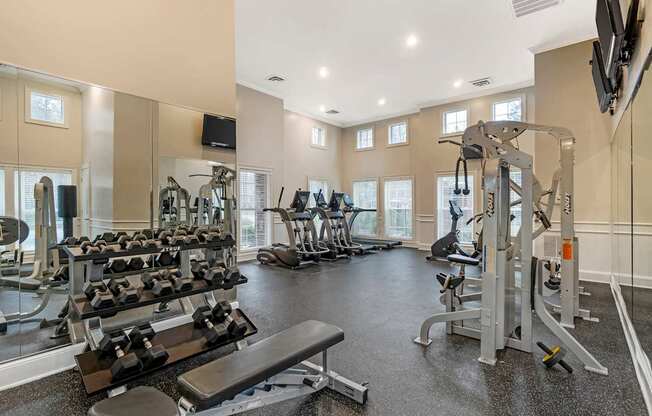 A spacious home gym with a variety of exercise equipment.