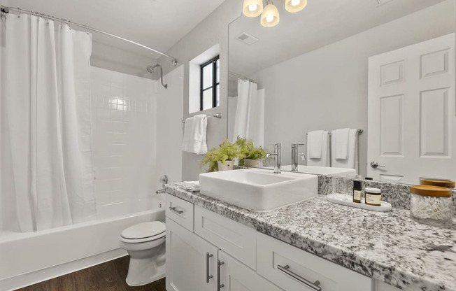 a bathroom with a sink and a toilet and a shower at Vaseo Apartments, Phoenix