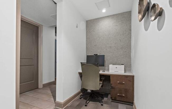A room with a desk and a chair.
