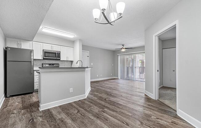 a kitchen with a wooden floor