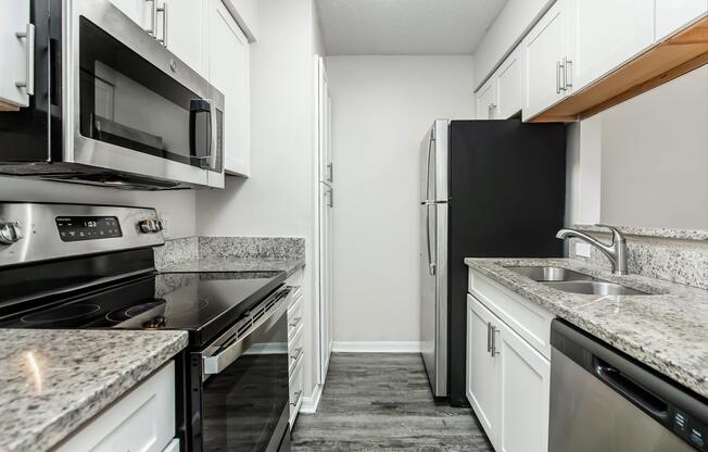 a modern kitchen with stainless steel appliances