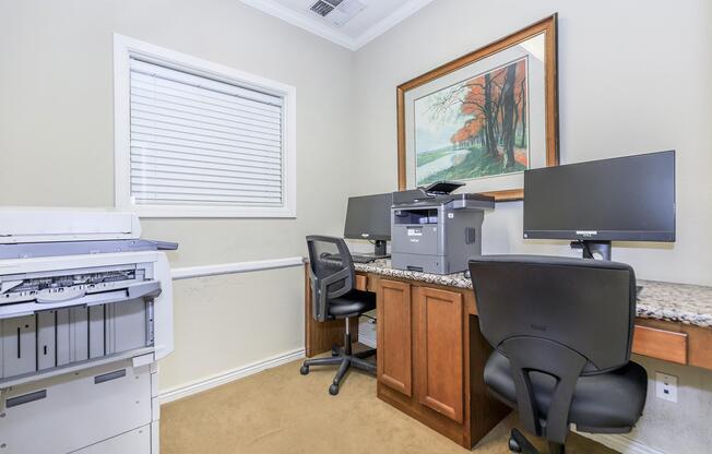 a home office with a desk and chair in a room