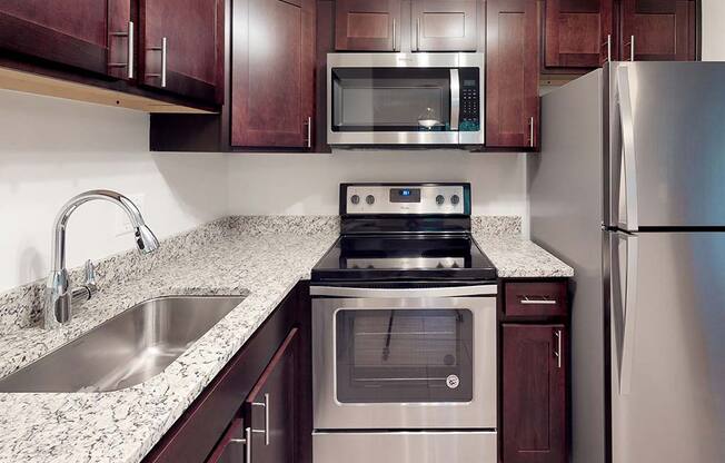 Granite counters in kitchen space in apartment unit at Tysons Glen Apartments and Townhomes, Falls Church