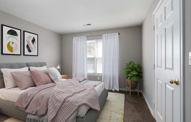 a bedroom with a bed and a plant and white curtains