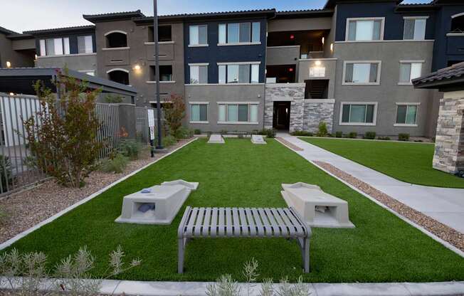 Two bag toss games and benches.