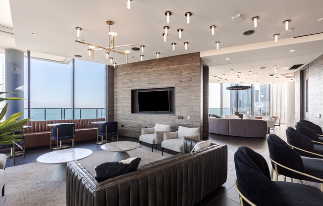 A modern living room with a fireplace and a large couch.